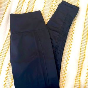 Fabletics black leggings with roushing on the bottom. Size small.